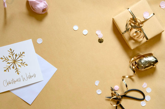 Christmas gifts for a long distance couple on a cozy holiday table